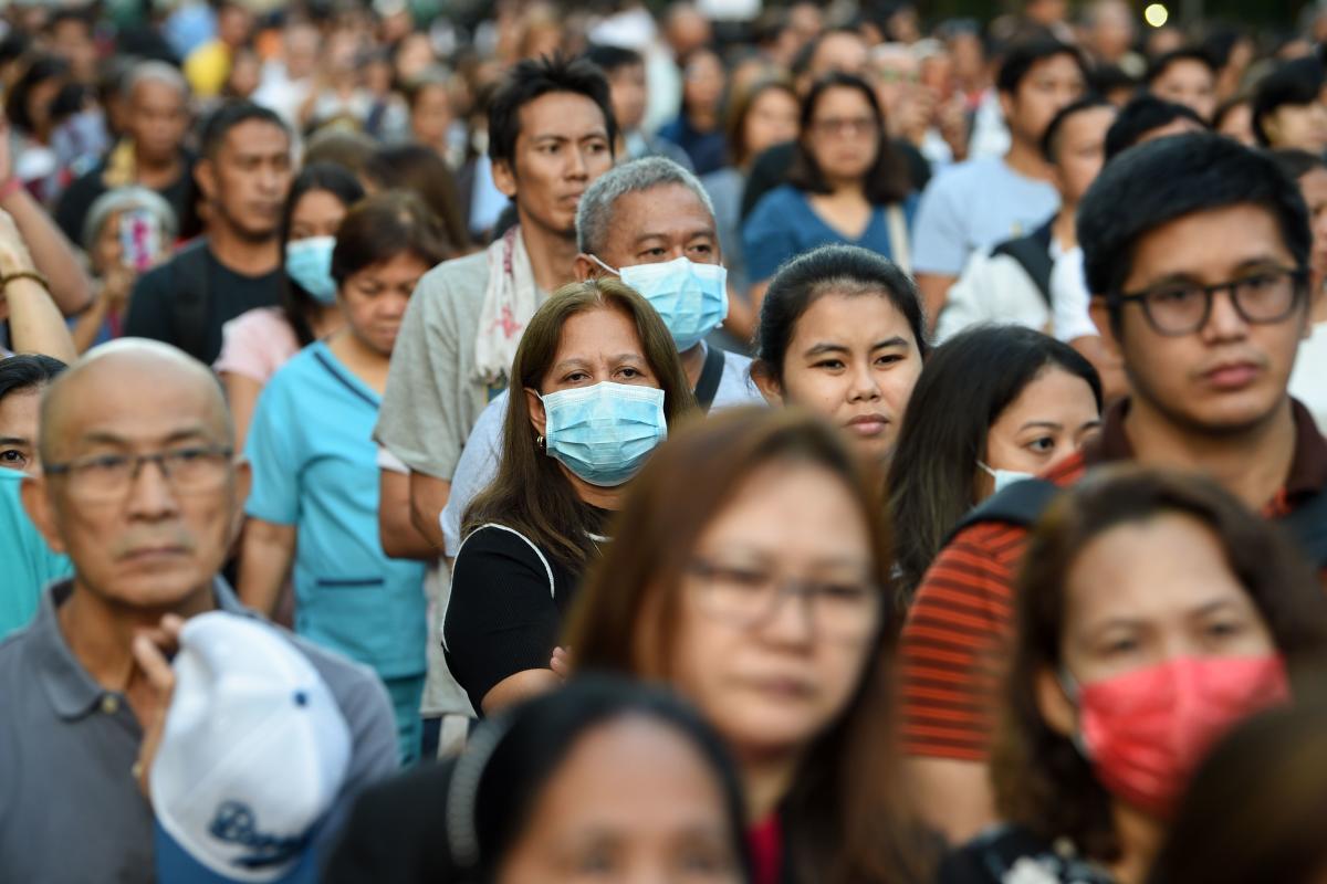 China reports 52 more virus deaths, lowest in 3 weeks