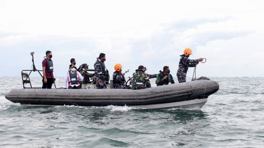 Indonesia rescuers find human remains after deadly plane crash