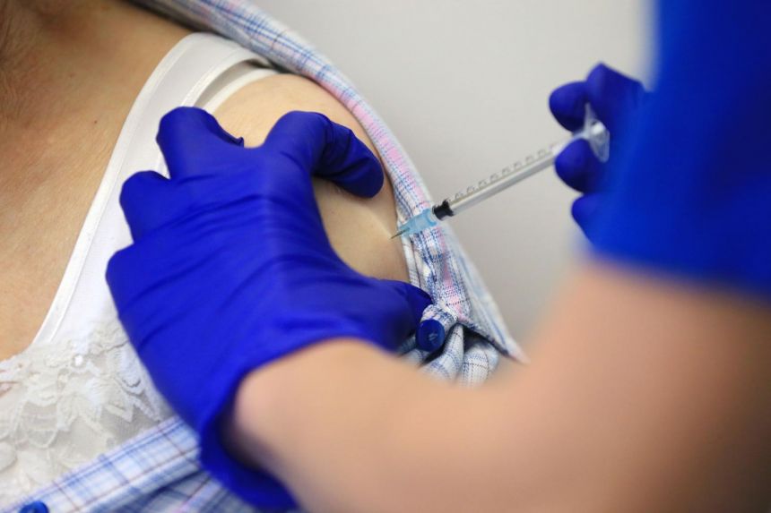 Slow vaccine rollouts fuel worry as US logs record coronavirus deaths