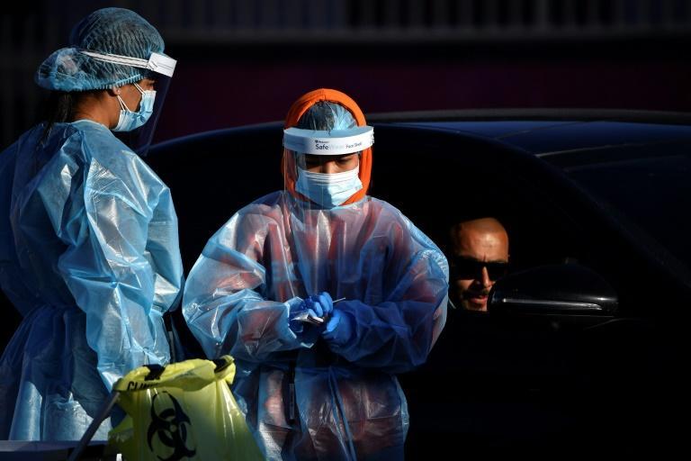 Melbourne back in lockdown as Sydney sees record Covid tally