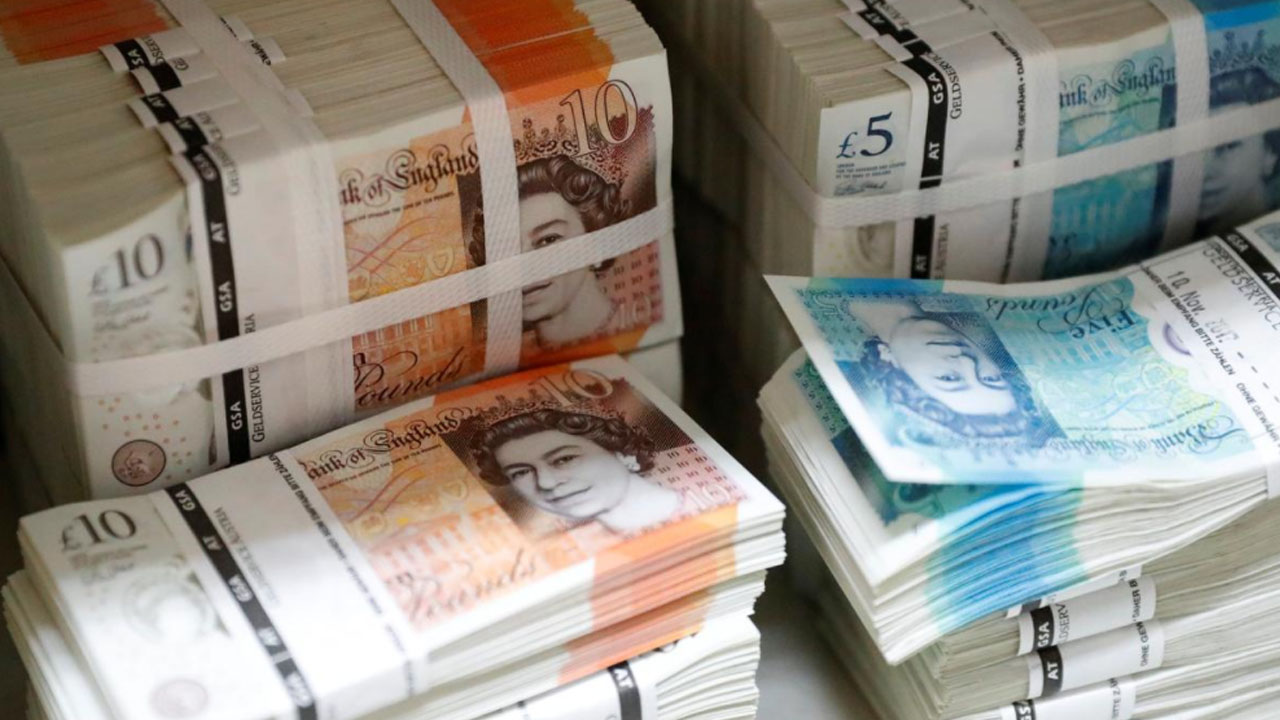 Pound slides to 18-month dollar low on weak UK data