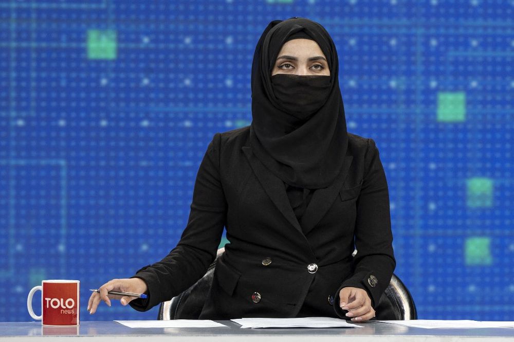 Afghan women TV presenters cover faces on air
