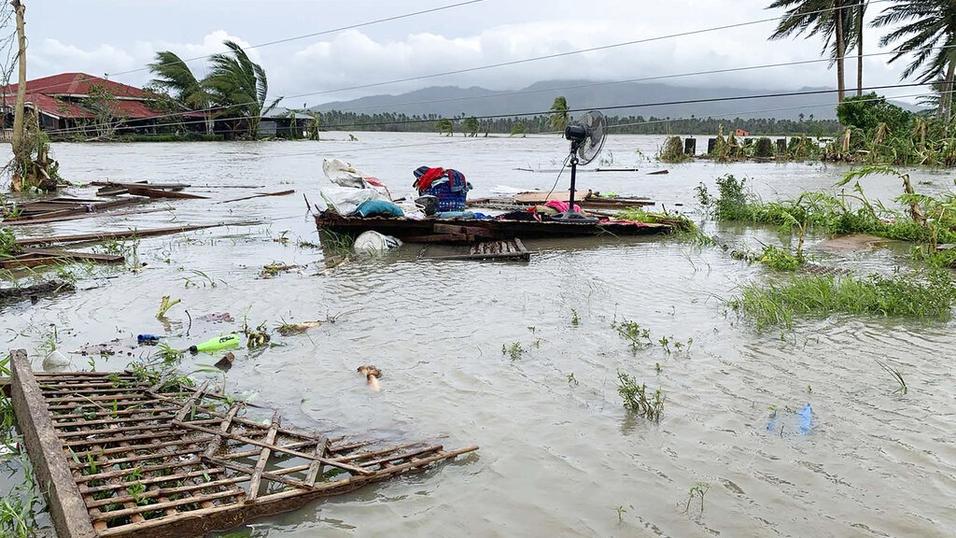 Philippines floods force tens of thousands to flee homes