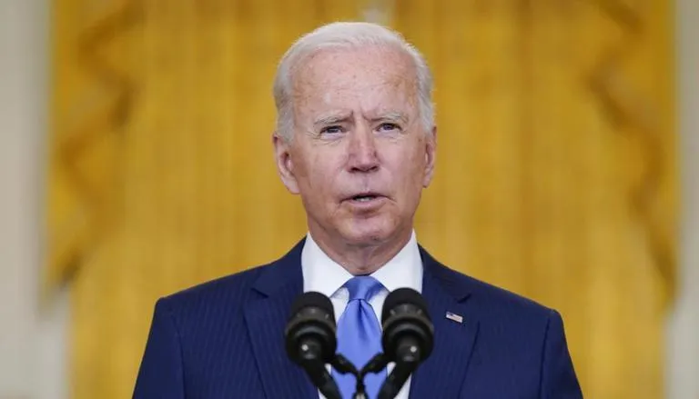 Government shutdown averted with little time to spare as Biden signs funding before midnight